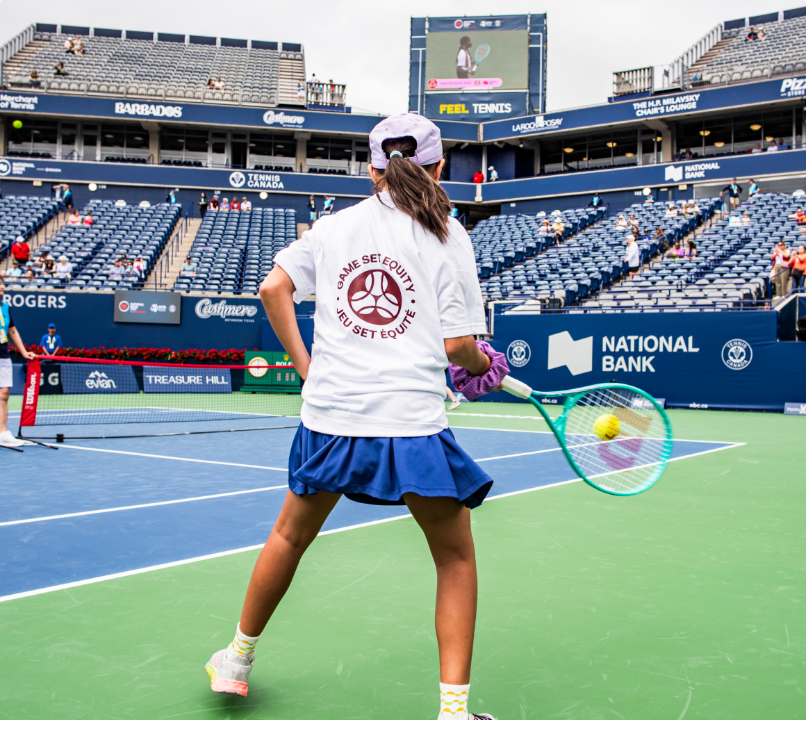 Photo of a young person playing tennis 