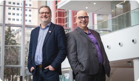 Photo of two business transfer specialists standing in the National Bank head office 