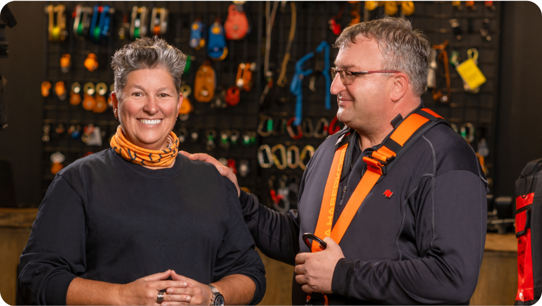Photo of a woman and a National Bank account manager standing in a store