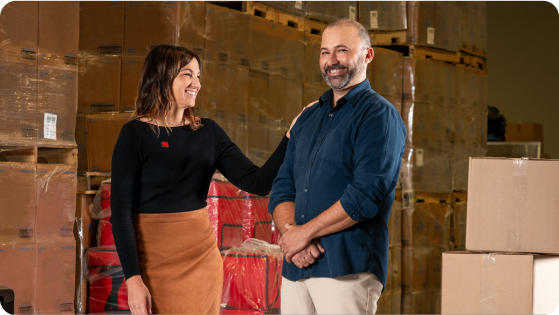 Photo of a man and a National Bank account manager standing in a warehouse