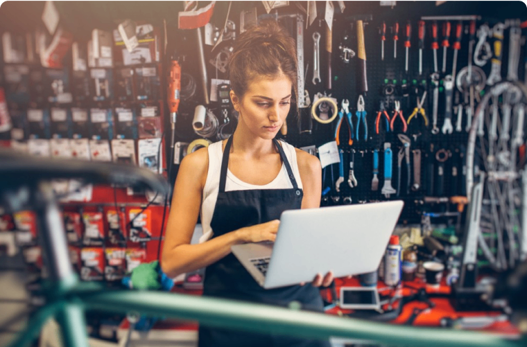 Photo of a person working in a bike shop