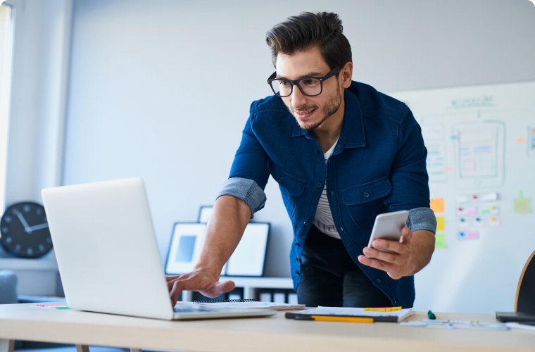 Photo of an entrepreneur on his computer searching for answers to his services for online banking questions in the Help centre