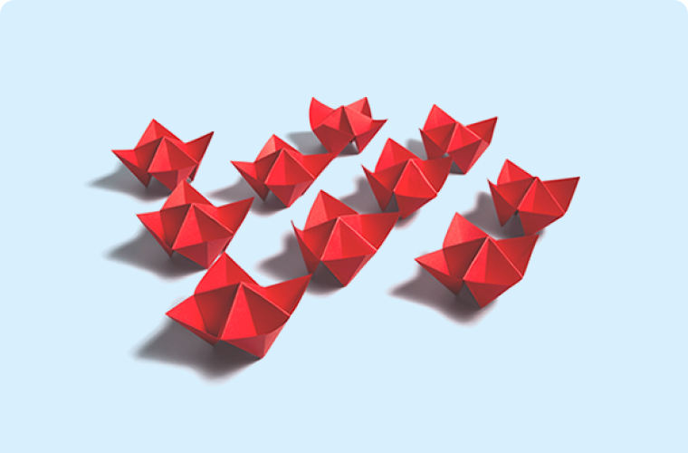 Illustration of small, red paper boats on a blue background 