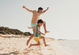 Father and son enjoying their time at the beach.