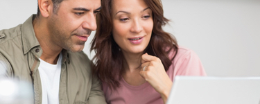 Couple using a laptop