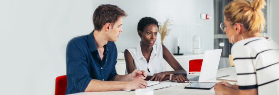 Couple sitting at table with banking advisor