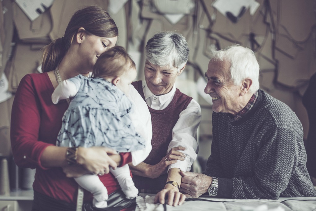 Three generations of a family business sharing a moment together.