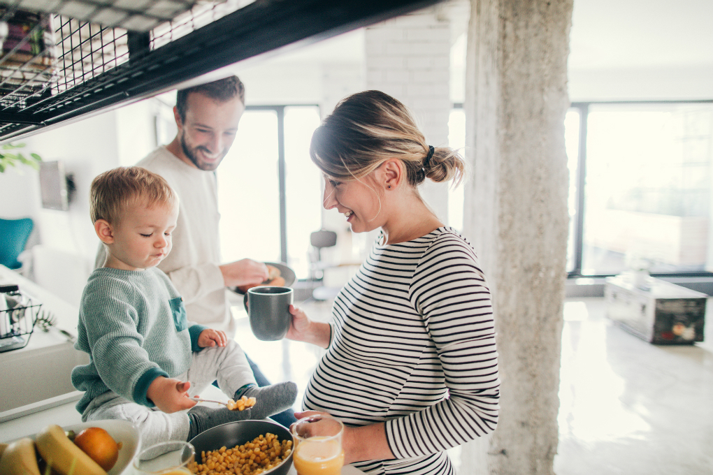 Family smiling, cooking together