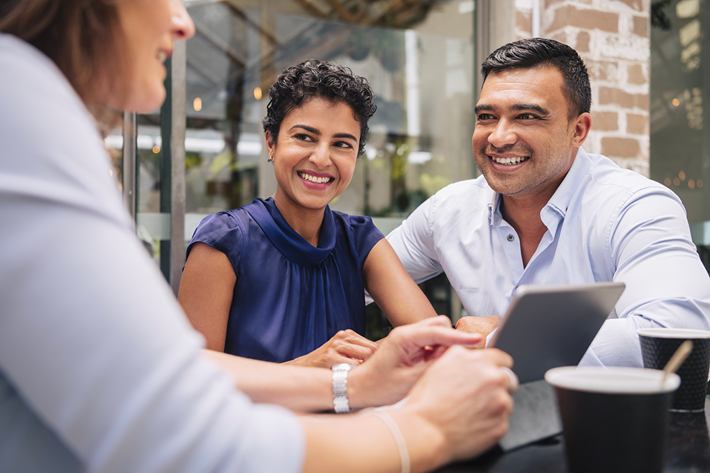 Couple in a meeting with their financial advisor