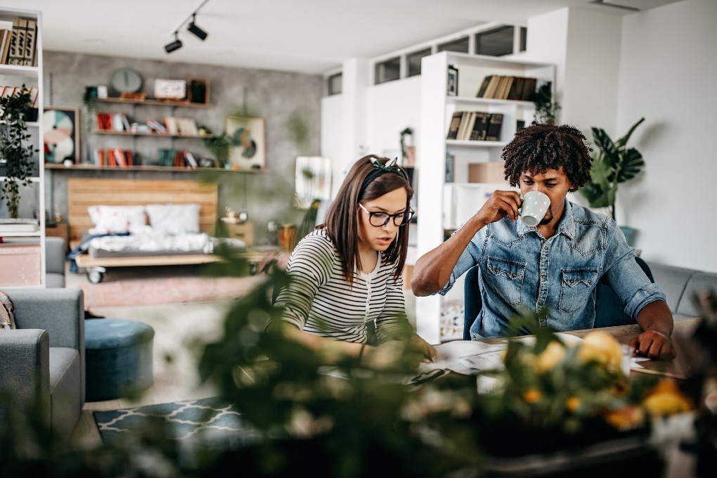 Young couple preparing a plan to pay off their debts. 