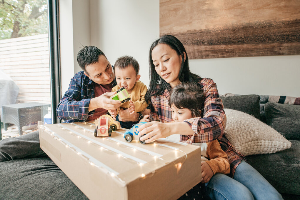 A couple playing with their children