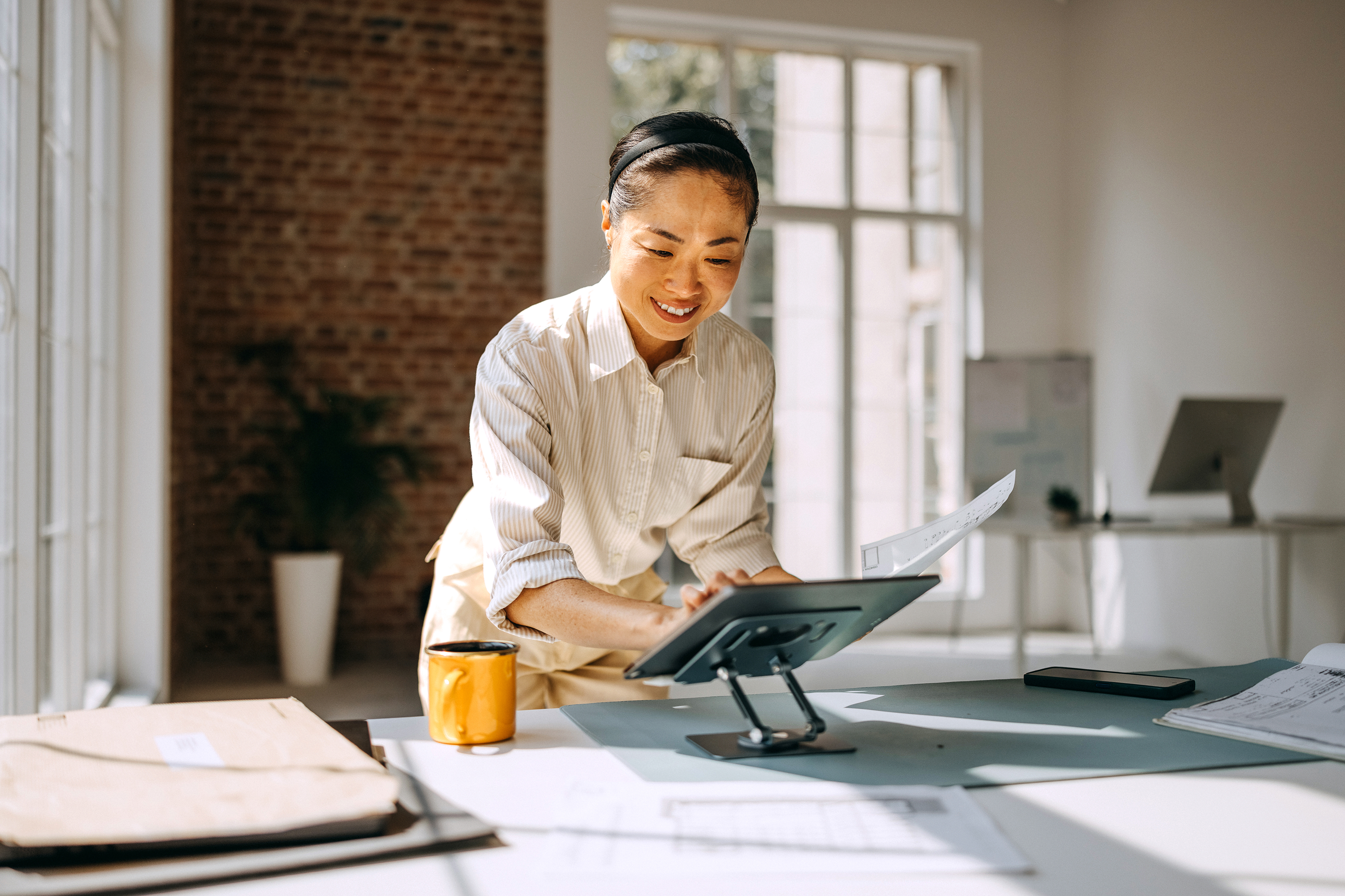 Female business owner using a tablet