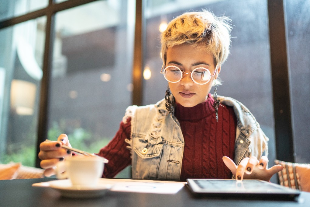 A young woman prepares her taxes for the first time. 