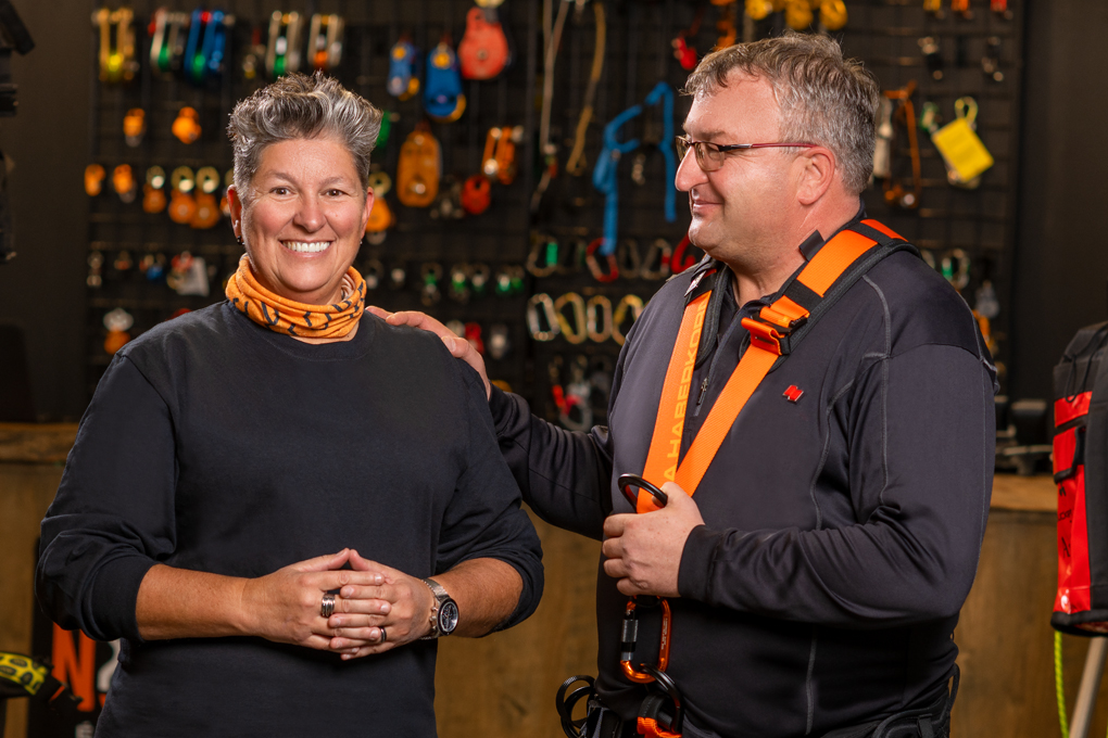 Photo of a National Bank advisor and their client speaking in a health and safety equipment store