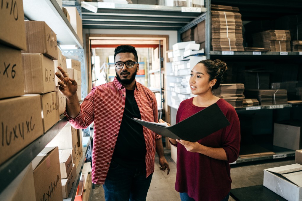 two people talking in a warehouse