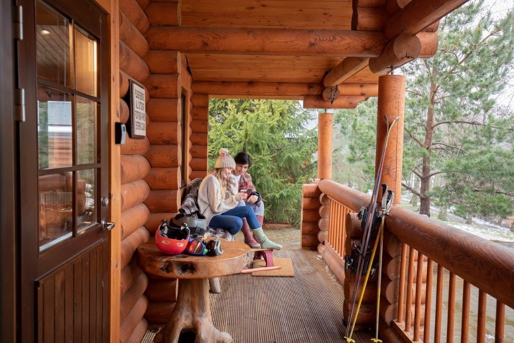 Couple speaking at the front of their second home