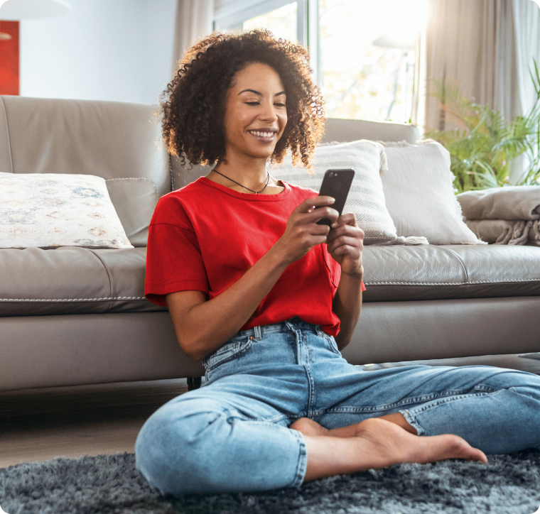 Photo of a person smiling in front of a cellphone