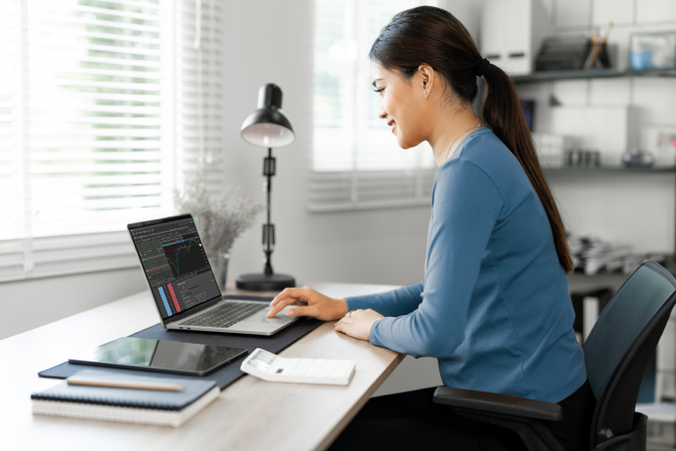 Photo of a person sitting in front of their computer