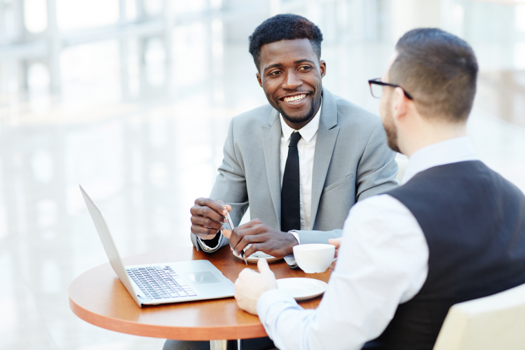 Photo of two people talking