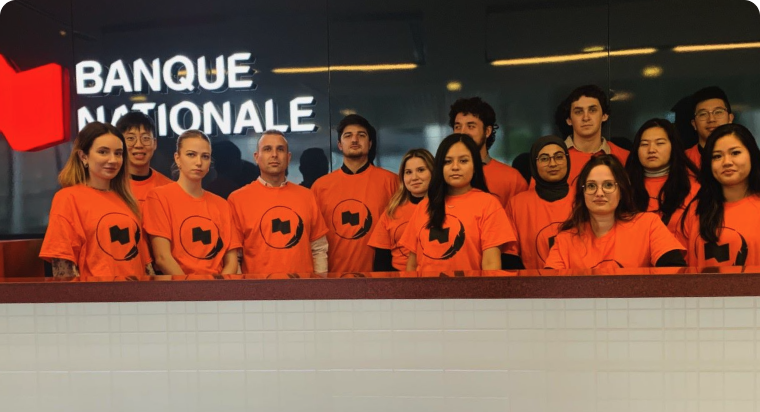 Photo of a group of people wearing orange representing our commitment to Indigenous issues and communities 