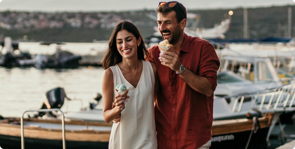 Photo of a couple enjoying ice cream on a boat